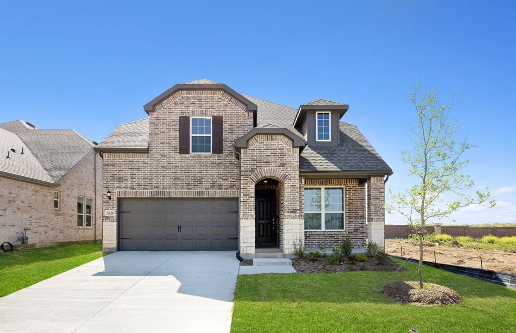 5821 Anning Way Pilot Point, TX 76258 - Photo 1 of 15 a front view of a house with garden