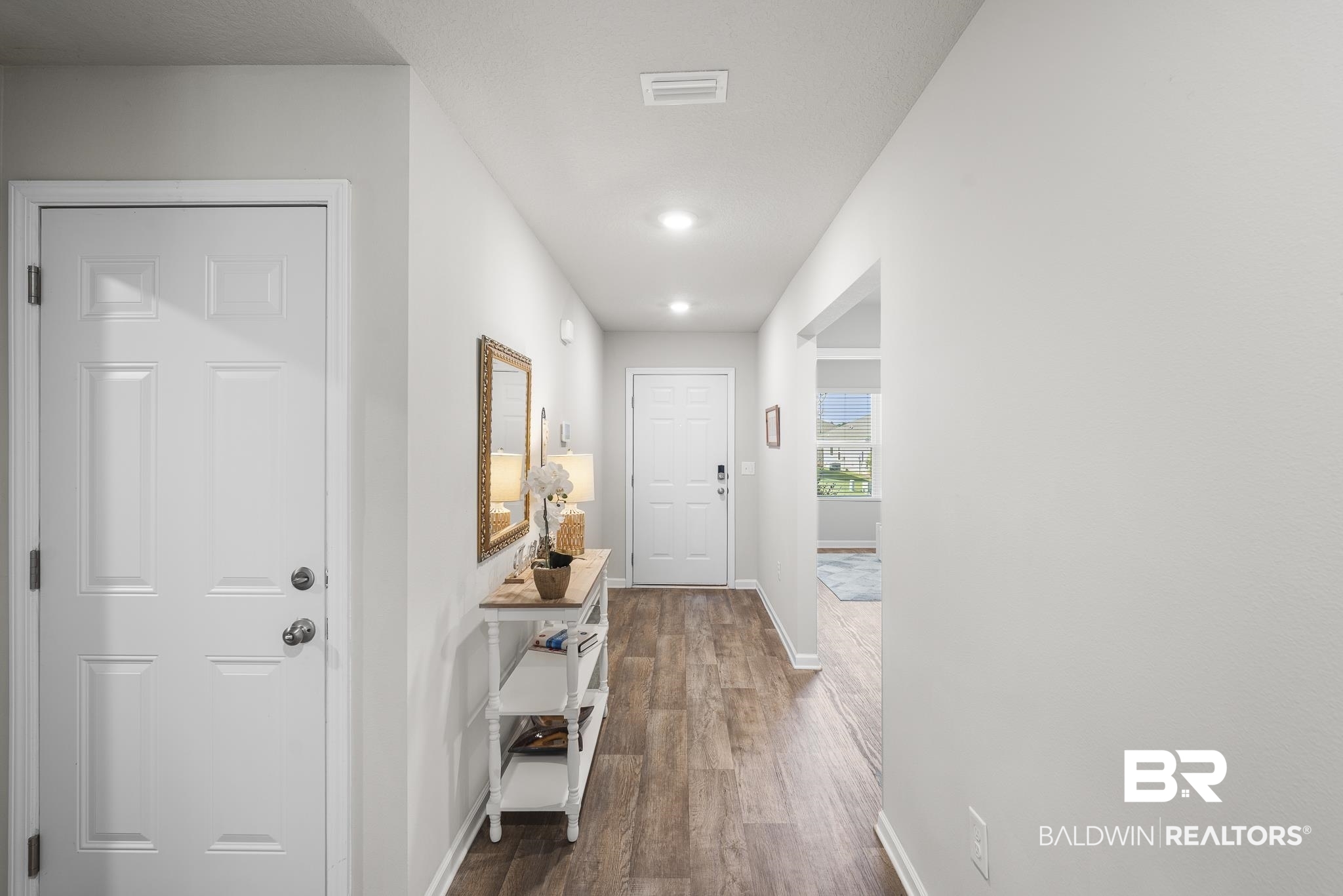 10232 Brodick Loop Spanish Fort, AL 36527 - Photo 4 of 29 Doorway featuring baseboards and wood finished floors