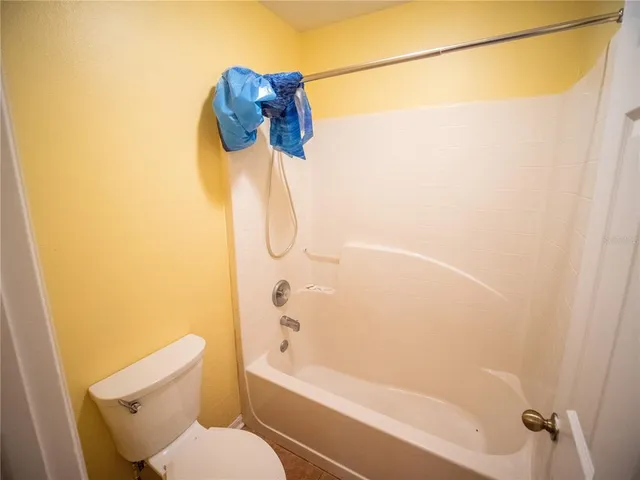 a bathroom with a shower and a toilet