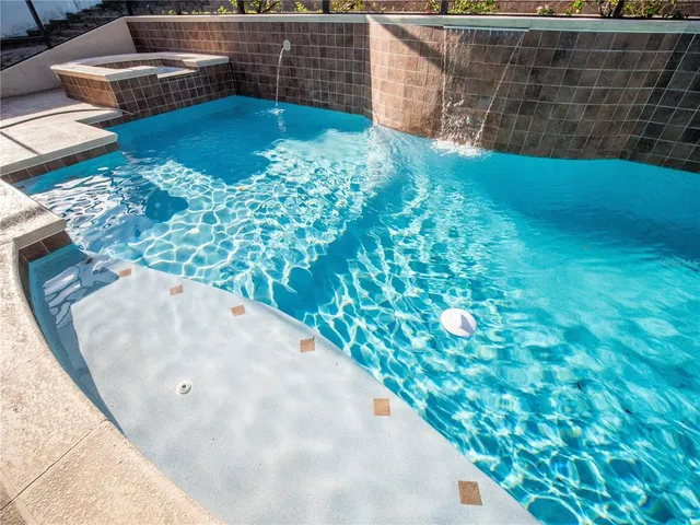 a view of a yard with wooden fence