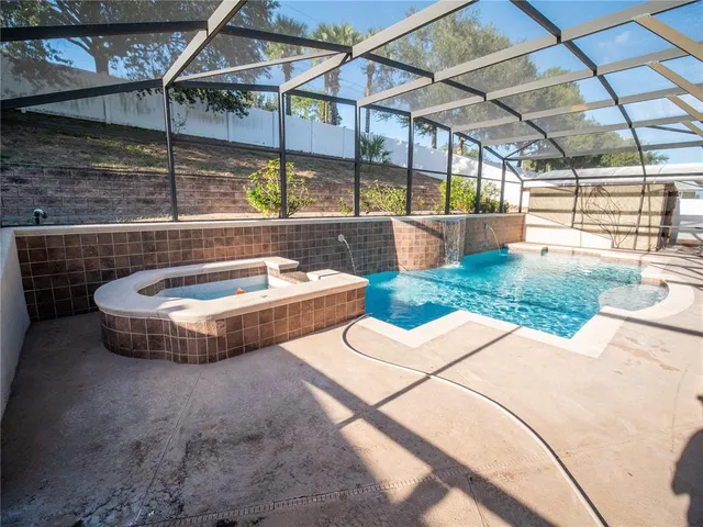 a view of a swimming pool with a patio