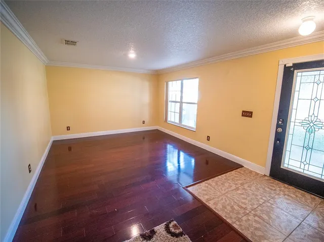 a view of an empty room and window