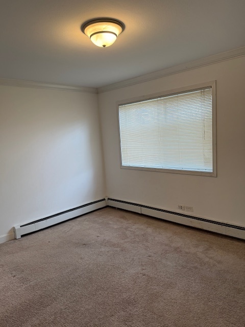 2234 South Goebbert Road, Unit 122 Arlington Heights, IL 60005 - Photo 19 of 29 an empty room with a window