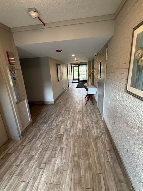 2234 South Goebbert Road, Unit 122 Arlington Heights, IL 60005 - Photo 7 of 29 a view of empty room with wooden floor and fan