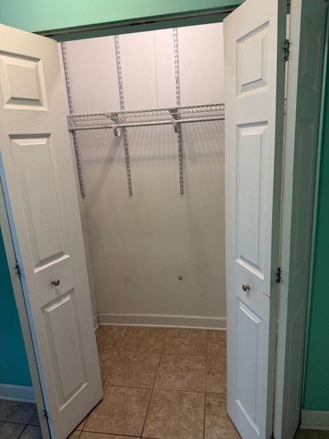 2234 South Goebbert Road, Unit 122 Arlington Heights, IL 60005 - Photo 10 of 29 a bathroom with a glass shower door