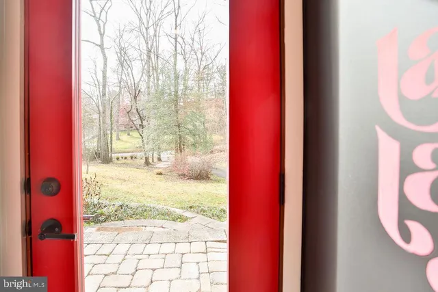 a view of a room with wooden floor and windows