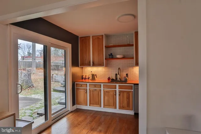 a view of a kitchen from the hallway