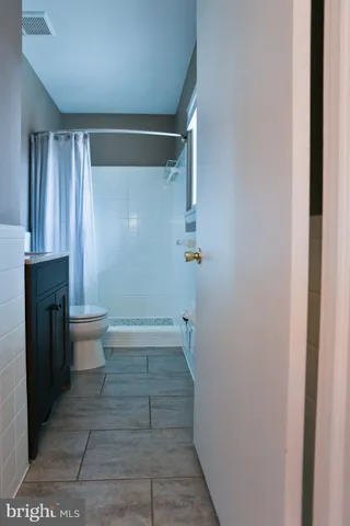 a bathroom with a sink and toilet