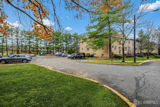a view of street with parked cars