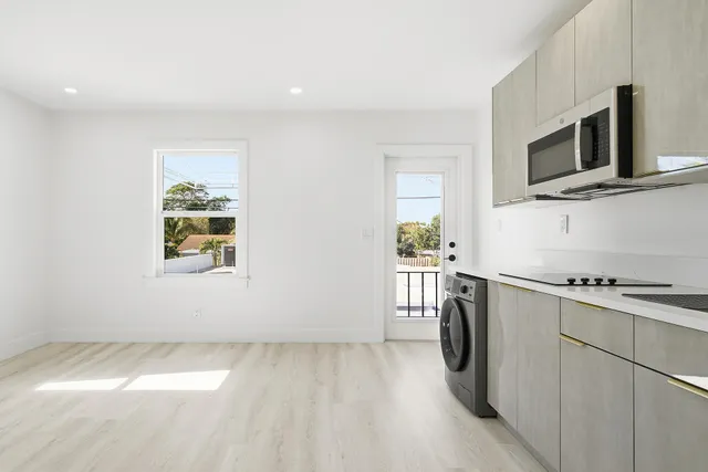 a kitchen with a microwave and a stove