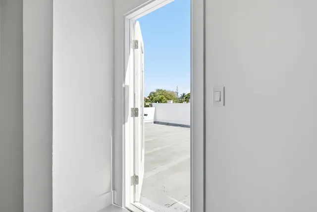 a view of a bathroom from a hallway