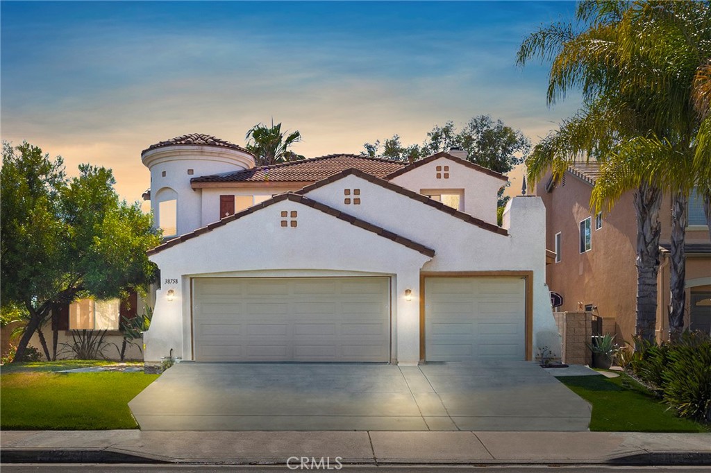 38758 Stone Canyon Road Murrieta, CA 92563 - Photo 1 of 1 a front view of a house with a yard and a garage
