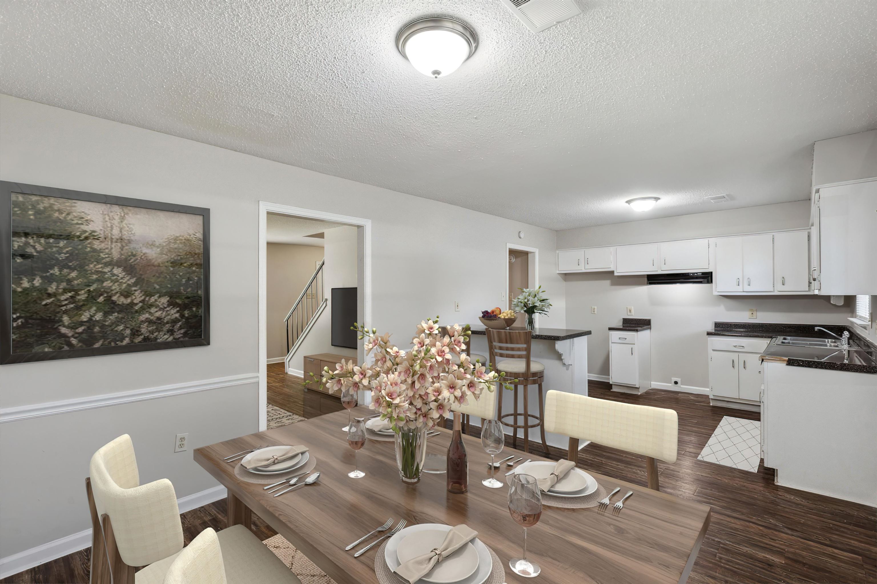 4160 Luther Road Bartlett, TN 38135 - Photo 12 of 28 Dining space featuring dark wood finished floors, stairway, visible vents, baseboards, and a textured ceiling