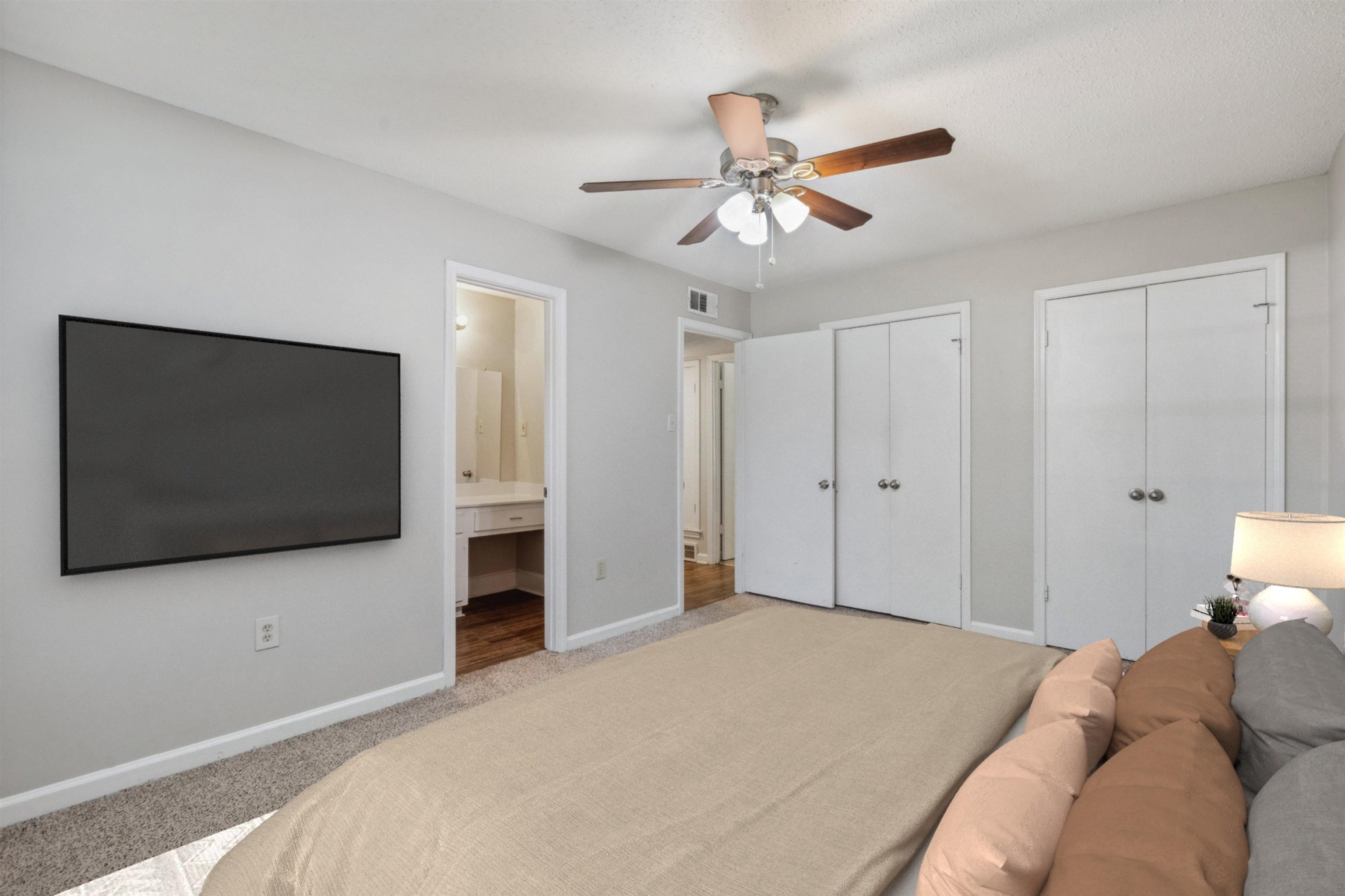 4160 Luther Road Bartlett, TN 38135 - Photo 17 of 28 Bedroom featuring carpet flooring, ensuite bathroom, visible vents, baseboards, and multiple closets