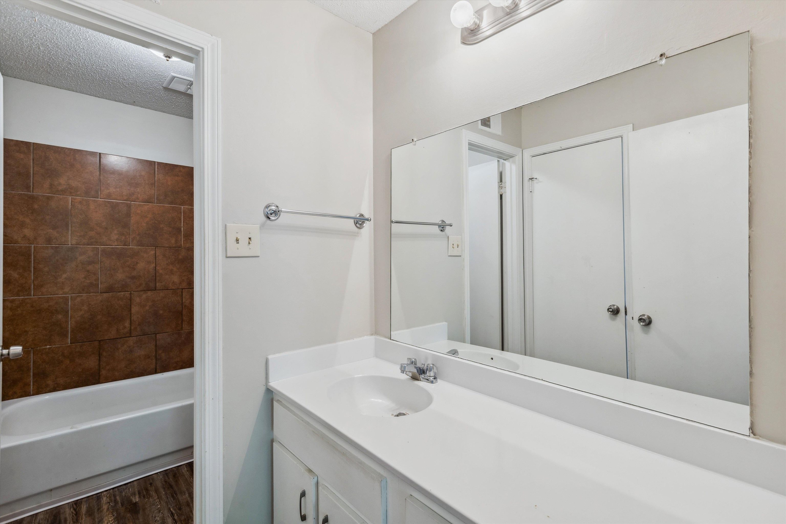 4160 Luther Road Bartlett, TN 38135 - Photo 18 of 28 Full bath featuring wood finished floors, a textured ceiling, and vanity