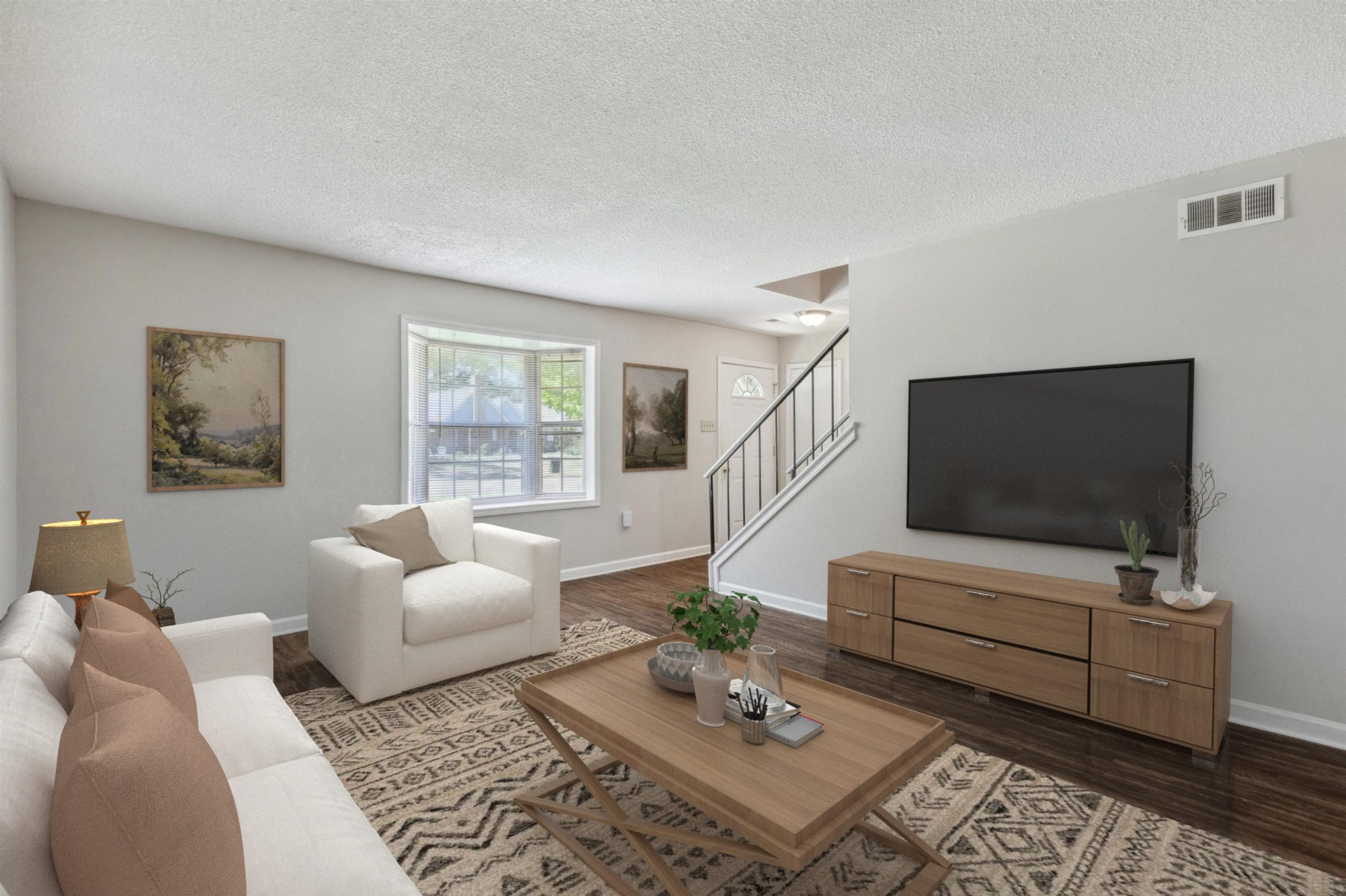 4160 Luther Road Bartlett, TN 38135 - Photo 7 of 28 Living area with baseboards, a textured ceiling, and visible vents