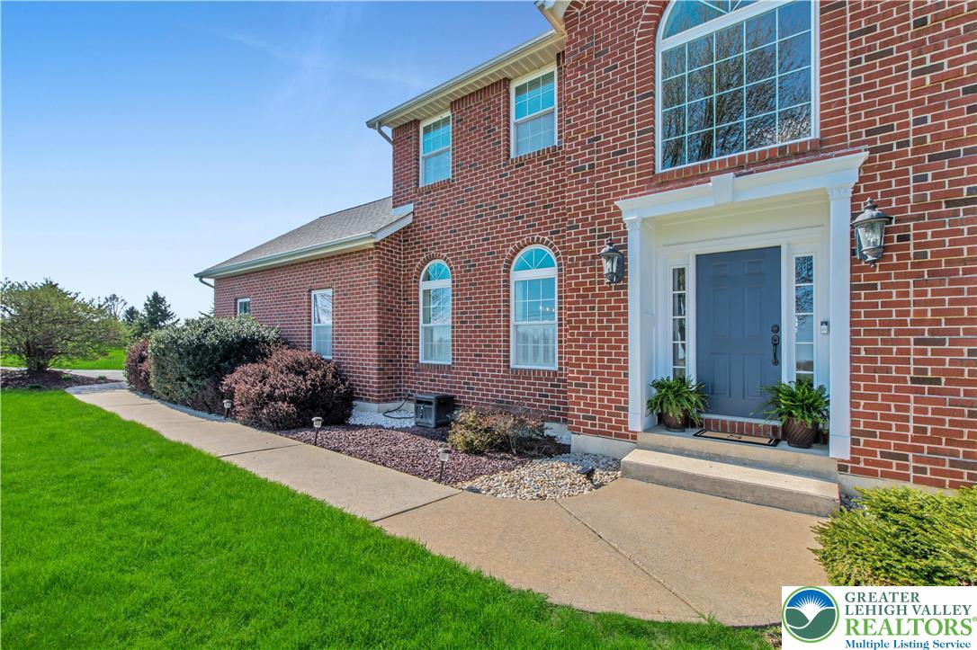 3110 Valley View Drive Bath, PA 18014 - Photo 2 of 64 a front view of a house with a garden and plants