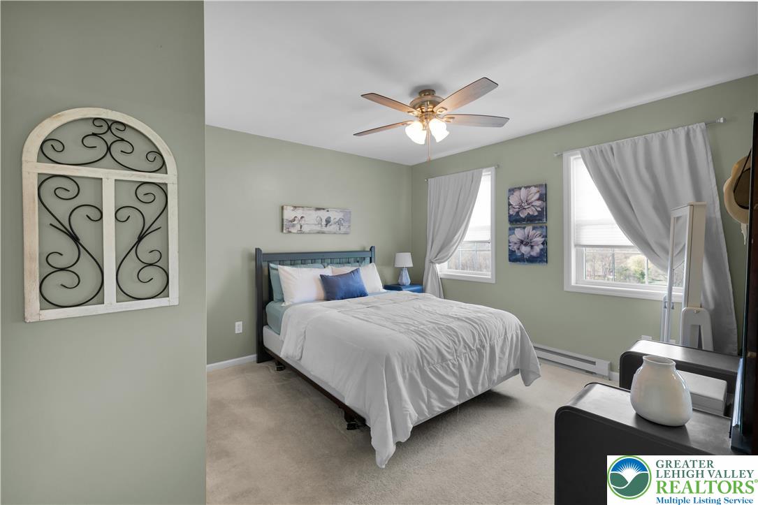 3110 Valley View Drive Bath, PA 18014 - Photo 21 of 64 a bedroom with a bed and a chandelier