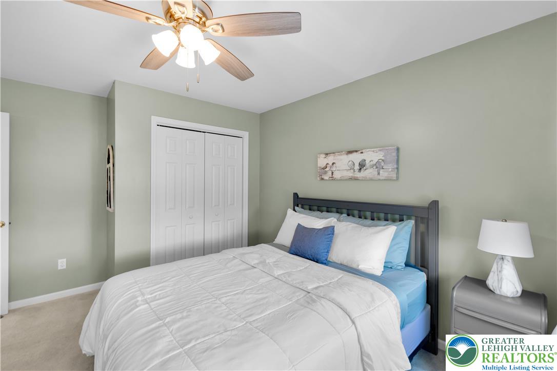 3110 Valley View Drive Bath, PA 18014 - Photo 22 of 64 a bedroom with a bed and a chandelier