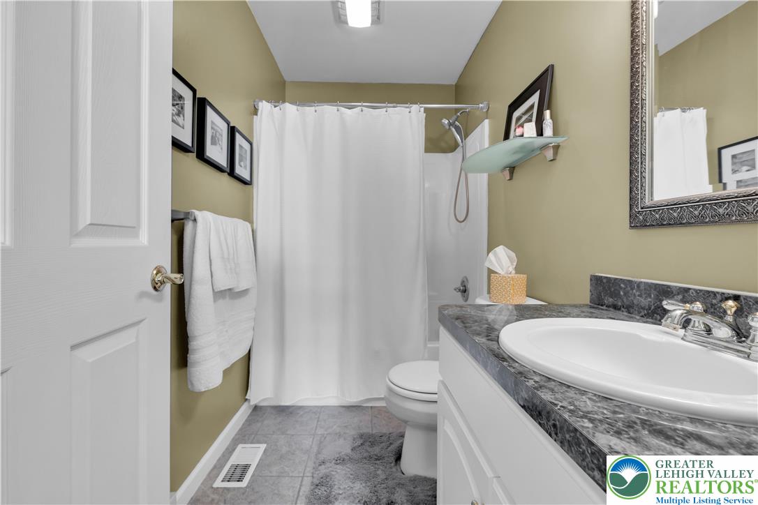 3110 Valley View Drive Bath, PA 18014 - Photo 23 of 64 a bathroom with a granite countertop sink toilet and shower