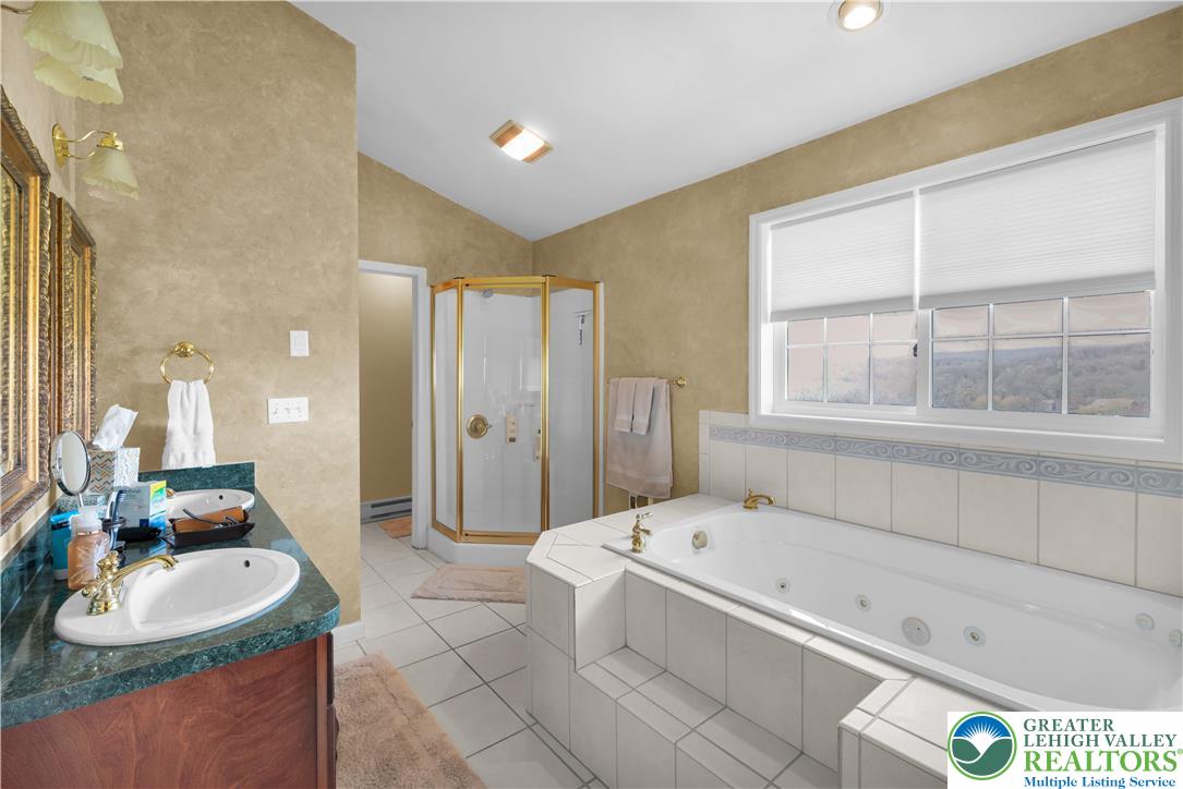 3110 Valley View Drive Bath, PA 18014 - Photo 28 of 64 a bathroom with a granite countertop tub and a sink