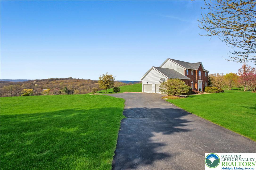 3110 Valley View Drive Bath, PA 18014 - Photo 56 of 64 a view of a big house with a big yard and large trees