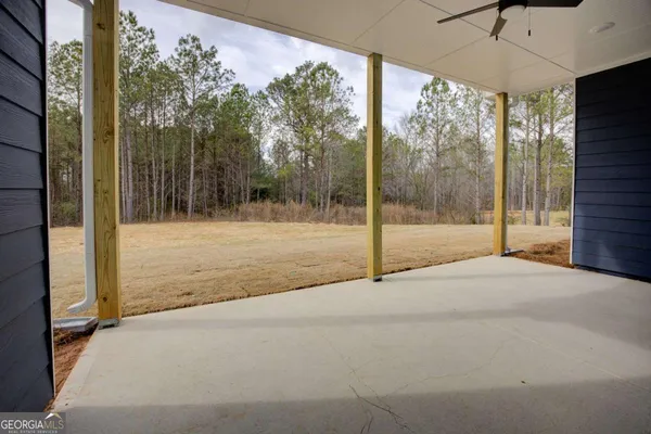 a view of backyard and floor to ceiling window