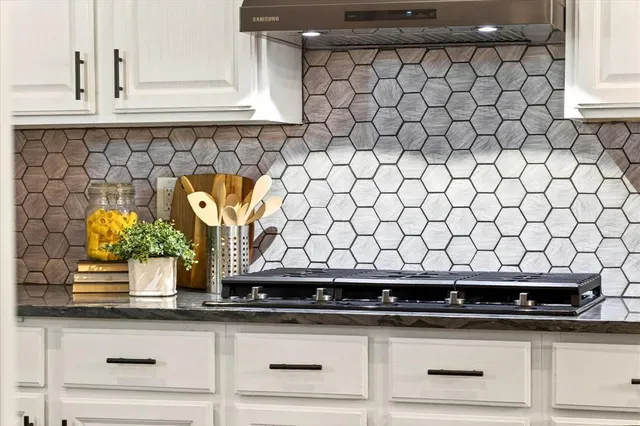 a kitchen with a sink and cabinets