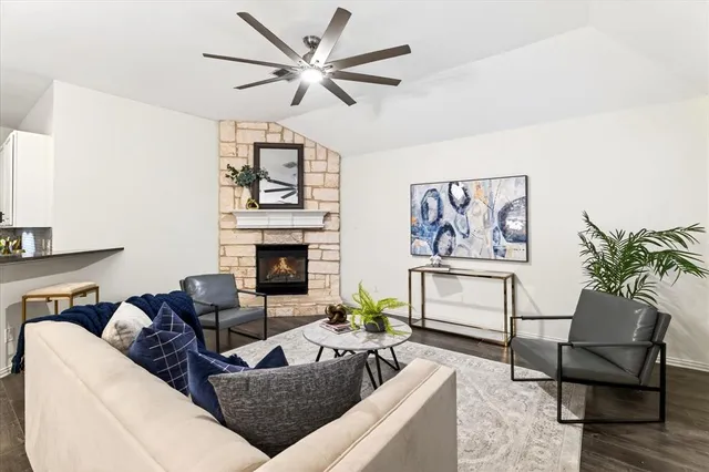 a living room with furniture and a fireplace