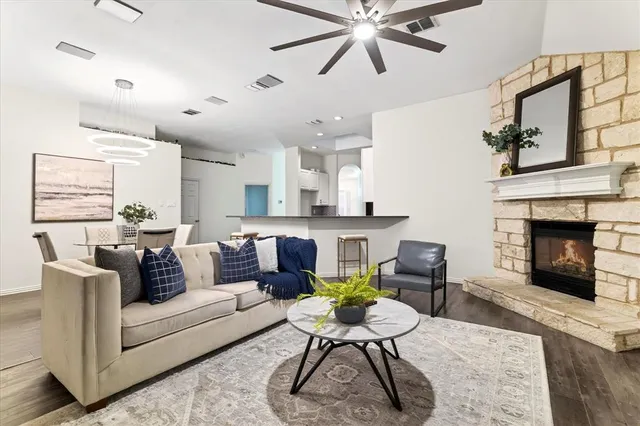 a living room with furniture and a fireplace
