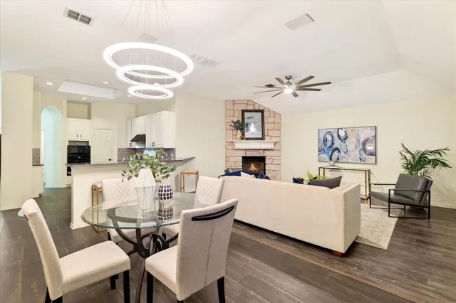 a view of a dining room with furniture and wooden floor