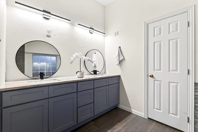 a view of living room with a mirror and a wooden floor