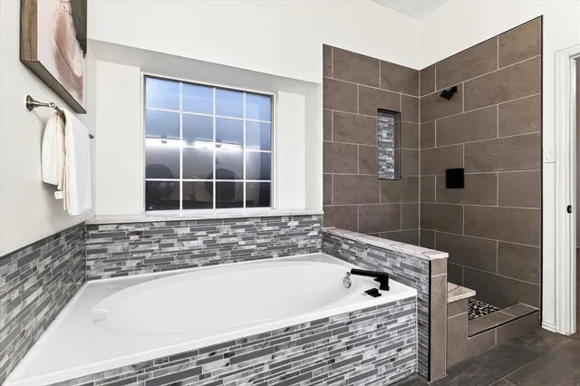 an aerial view of a house with a swimming pool