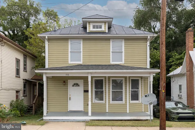 a front view of a house with glass windows