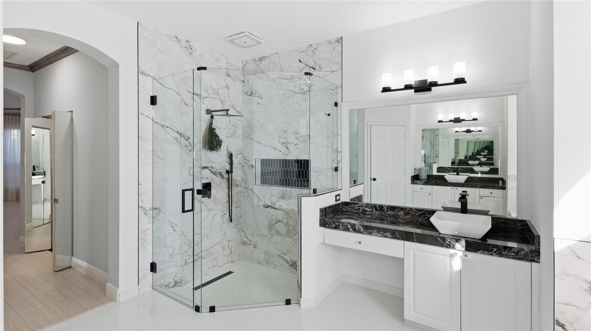 10141 Umberland Place Boca Raton, FL 33428 - Photo 19 of 26 a bathroom with a granite countertop sink a mirror and shower