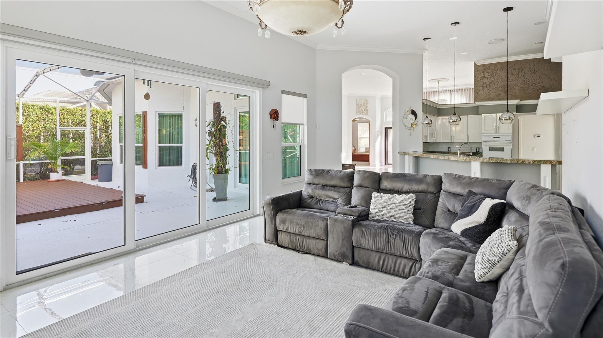 10141 Umberland Place Boca Raton, FL 33428 - Photo 10 of 26 a living room with furniture and a large window