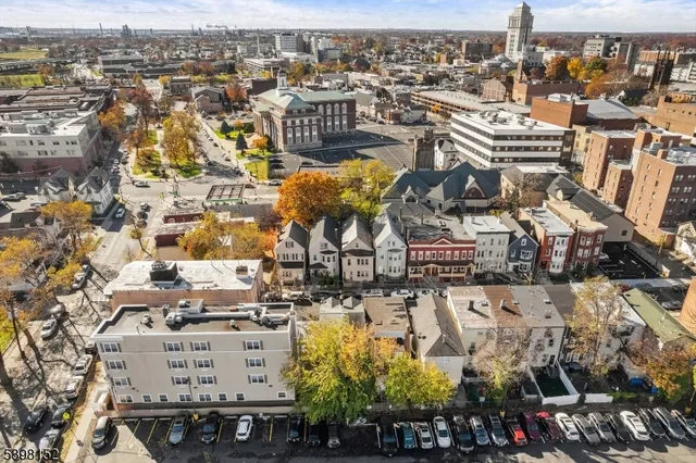 an aerial view of residential building and parking space