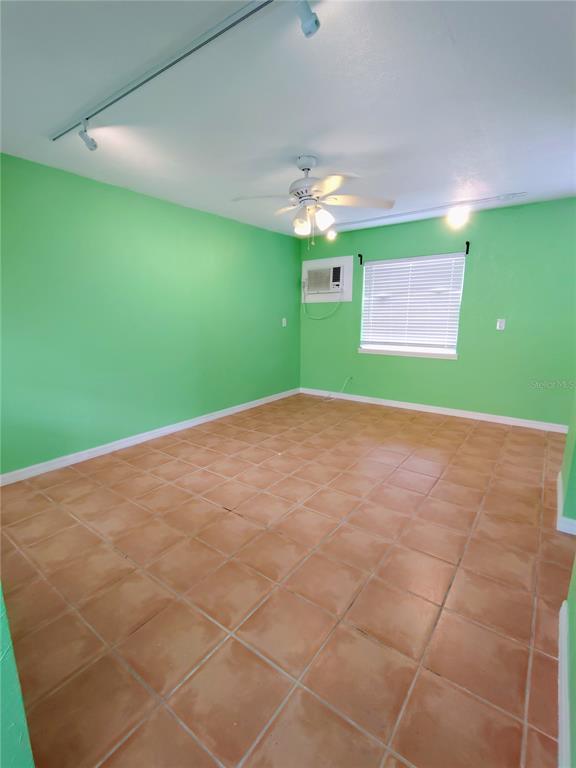 115 145th Avenue, Unit 4 Madeira Beach, FL 33708 - Photo 4 of 11 a view of a big room with a big yard
