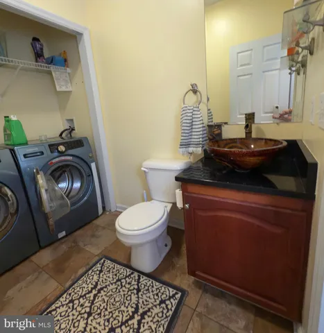 a bathroom with a toilet and a sink