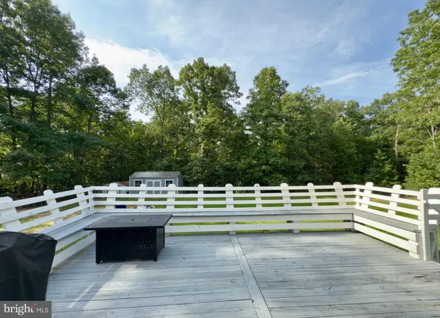 a roof deck with a table and chairs