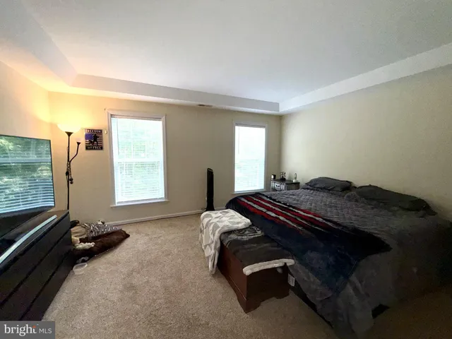 a room with a bed and a window