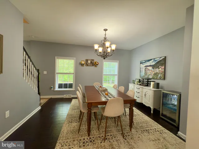 a view of a dining room with furniture and window