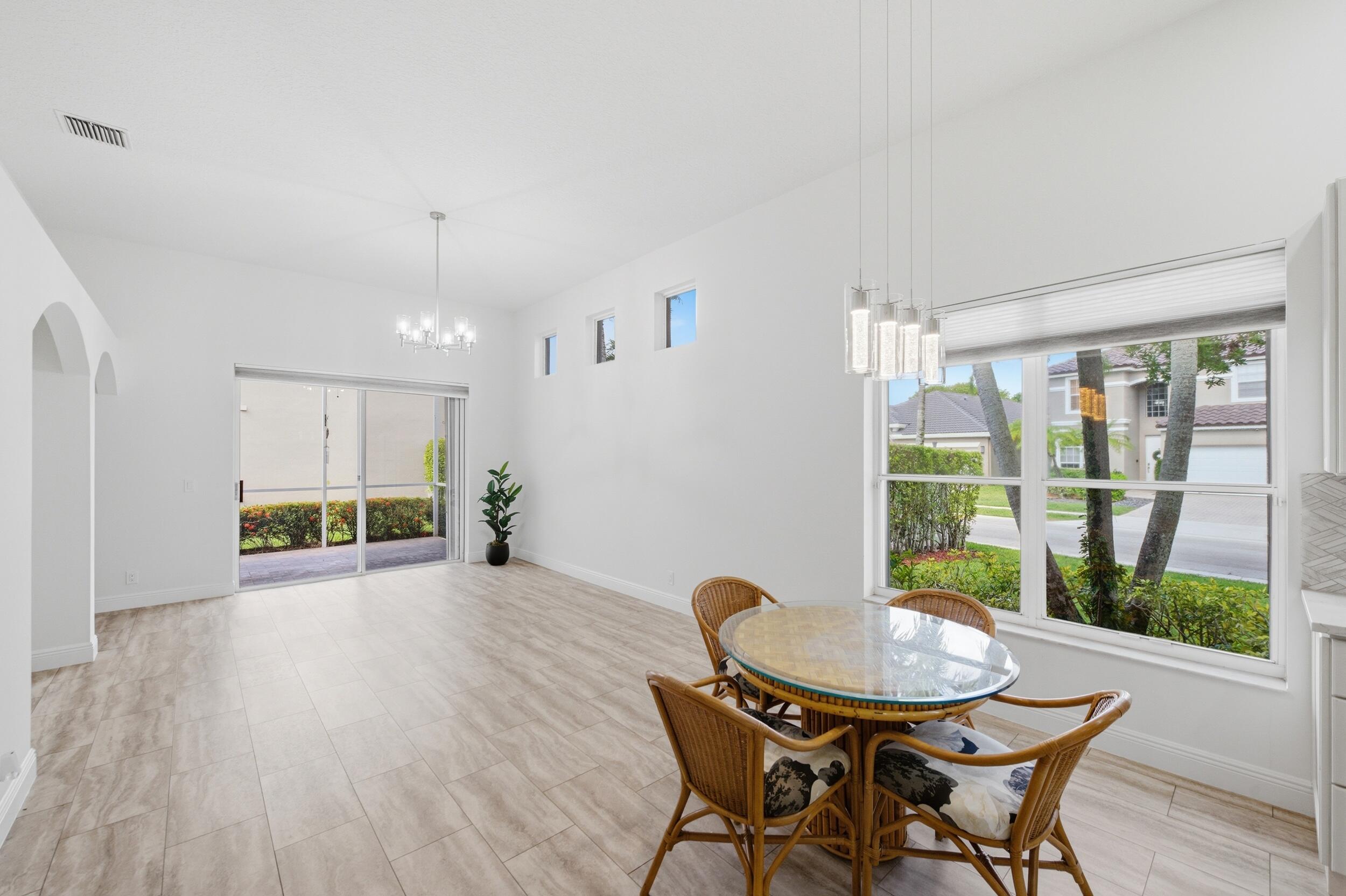 8534 Vía D Oro Boca Raton, FL 33433 - Photo 19 of 34 a view of a dining room with furniture and wooden floor