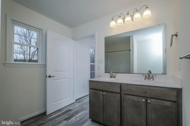 a view of deck with wooden fence and trees