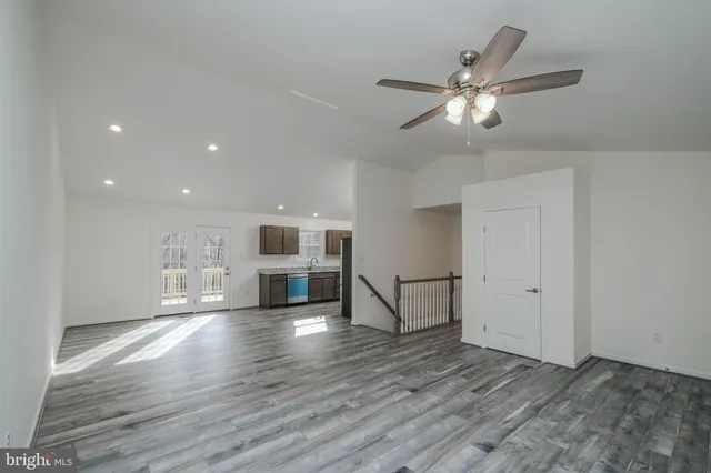 a kitchen with granite countertop stainless steel appliances and wooden cabinets