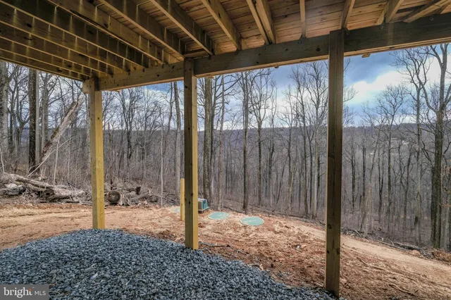 a view of a sign that is sitting in the grass