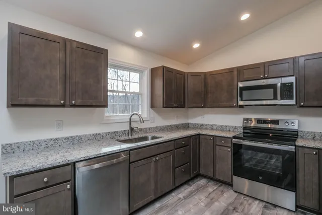 a kitchen with a sink and a microwave