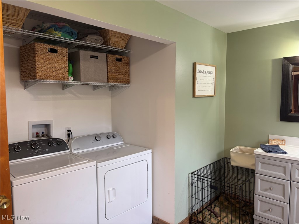 6380 Old River Road Philo, OH 43771 - Photo 22 of 26 Laundry area featuring washer and clothes dryer and laundry area