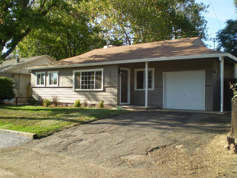 1013 Layton Road Redding, CA 96002 - Photo 1 of 15 a front view of a house with a yard