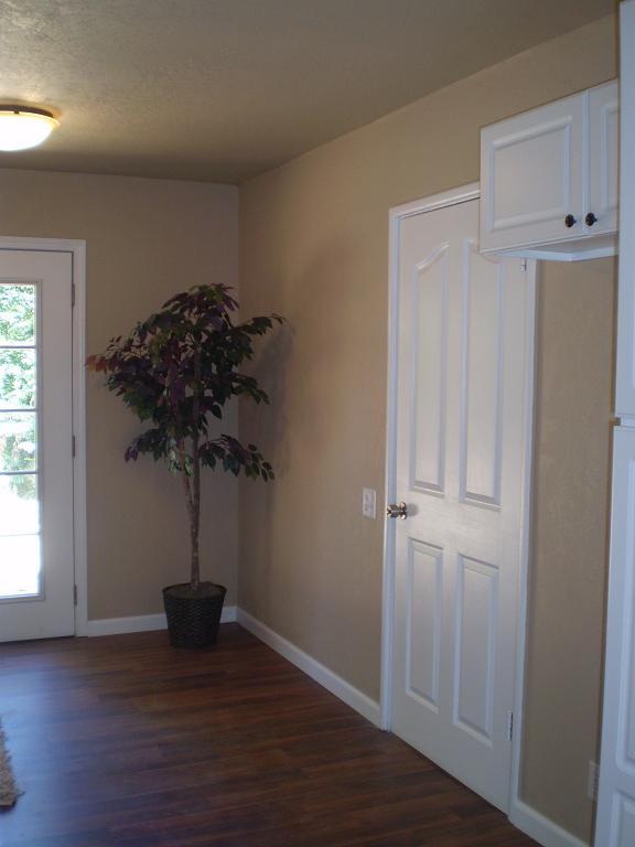 1013 Layton Road Redding, CA 96002 - Photo 11 of 15 an empty room with wooden floor and a window